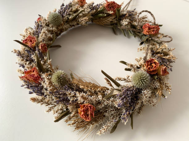 istock Decorative Wreath with dried flowers isolated on white 1300564853