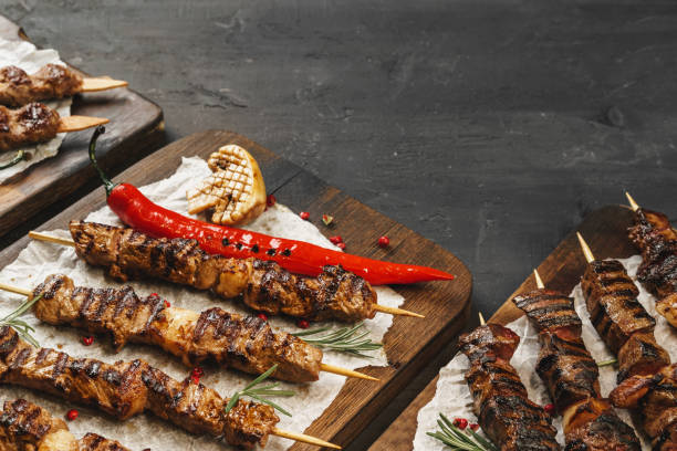 istock Grilled meat skewers barbecue served on board 1300565187