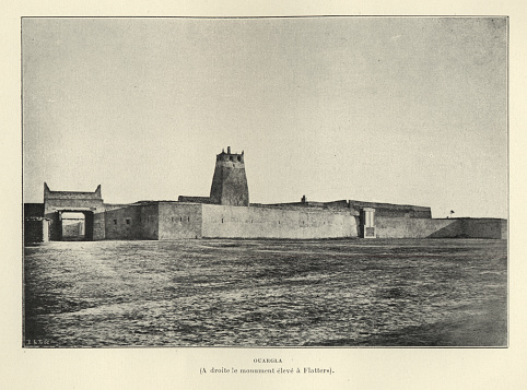 Antique photograph of Ouargla, Algeria, 19th Century. On the right the monument erected to Flatters