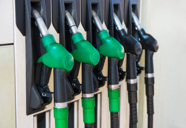 istock Different gas diesel pistols, at  gas station. 1300567154
