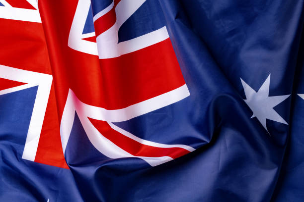 istock National flag of Australia, fabric textile background 1300568611