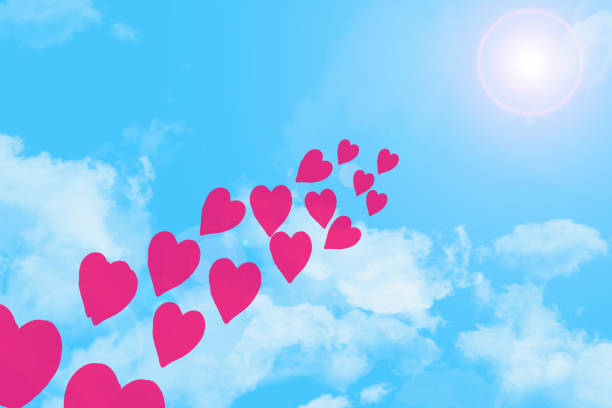 istock Blue sky with white clouds, hearts and clouds . Digital art painting design elements for Valentineâs Day. 1300569653