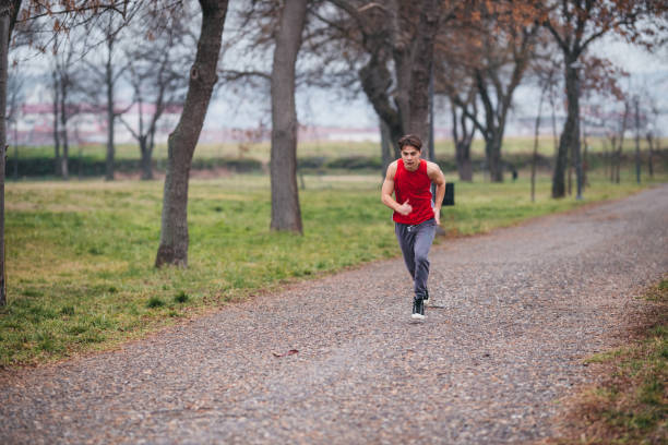istock Active healthy runner jogging outdoor in nature 1300571293