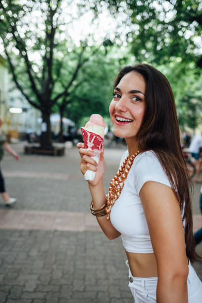 istock Woman Enjoy Ice Cream 1300571478