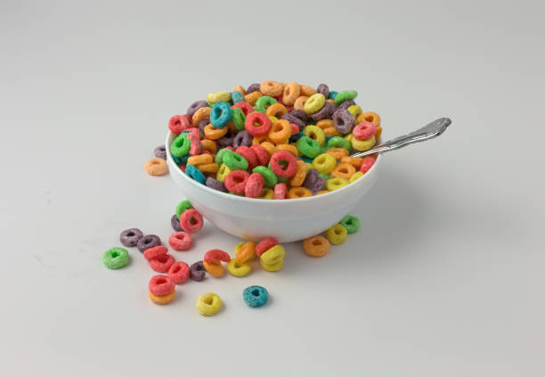 istock Sugar coated fruity flavored cereal in a bowl with milk and spoon 1300574392
