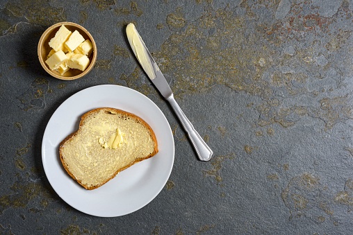 High angle view of rye bread with butter image made in studio