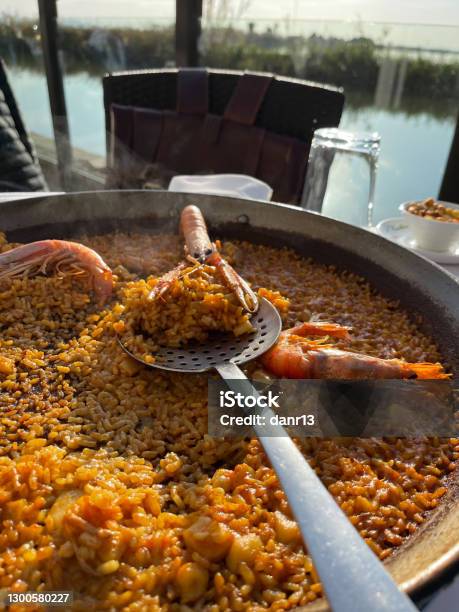 Delicious Traditional Paella Served In El Palmar Spain Stock Photo - Download Image Now