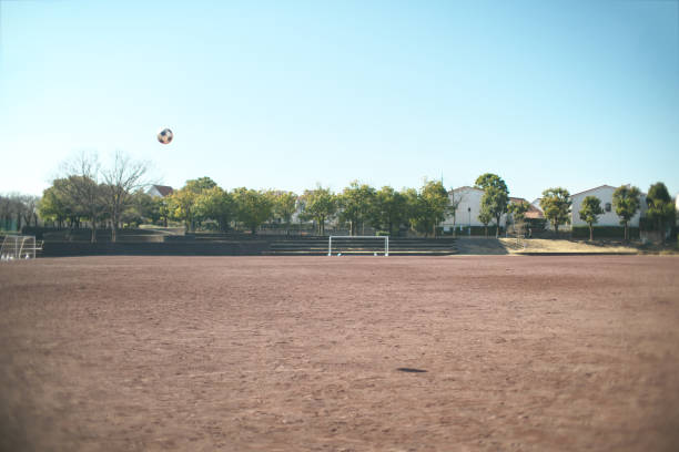 Tokyo,Japan-February 5, 2021: A flying soccer ball in a field on a winter day