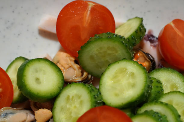 istock Green salad with tomatoes and cucumbers. Cabbage and red pepper. 1300581889