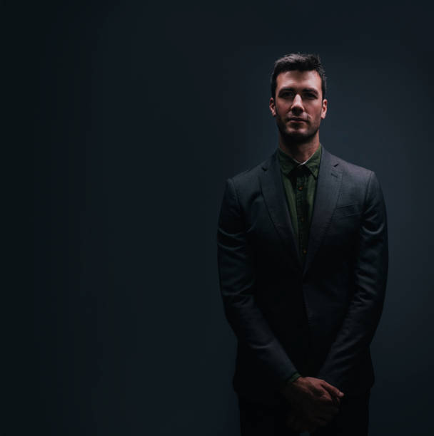 Free Stock Photo of Businessman in Suit and Tie Standing in the Dark ...