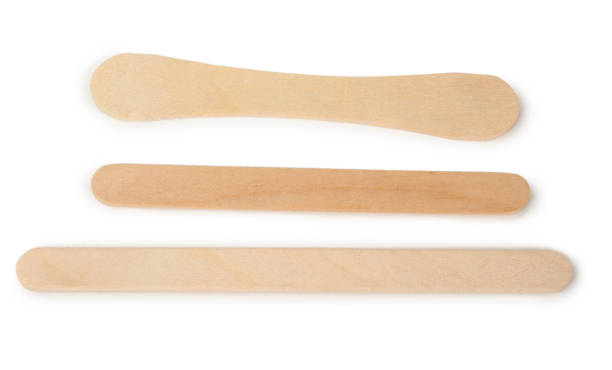 istock Wooden ice cream sticks on white background 1300583763