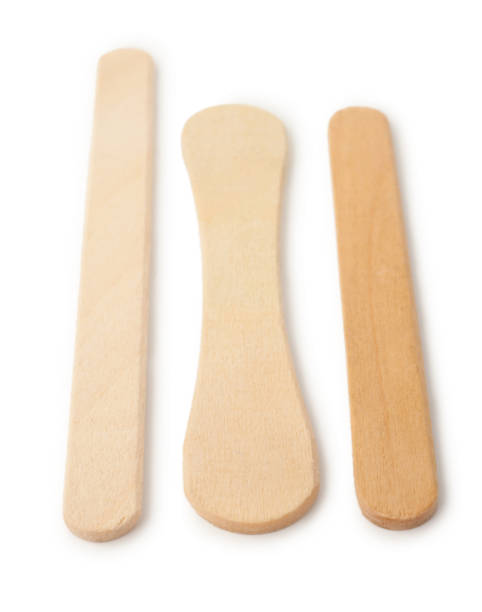 istock Wooden ice cream sticks on white background 1300584029