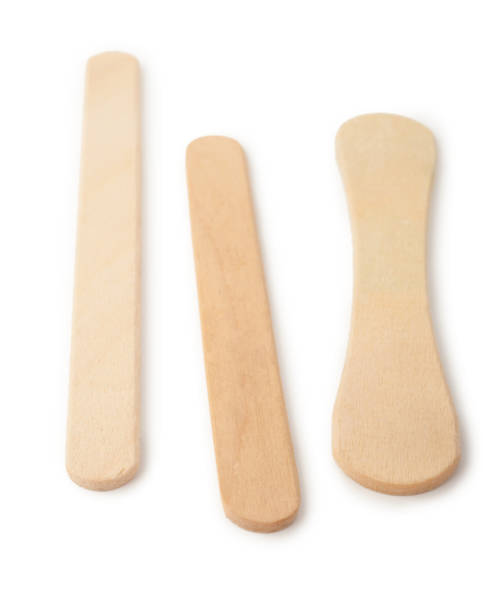 istock Wooden ice cream sticks on white background 1300584596