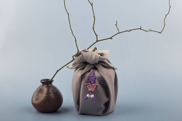 istock Korean traditional wrapping cloth gift box on the gray background. 1300591899