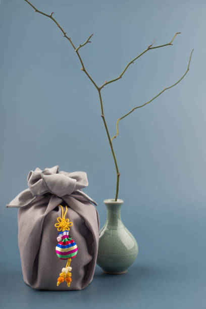 istock Korean traditional wrapping cloth gift box on the gray background. 1300591904