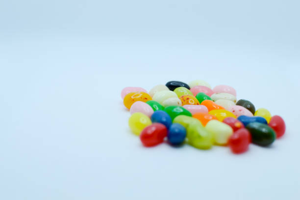 istock Colorful jelly beans arranged on white background for photograph 1300596102