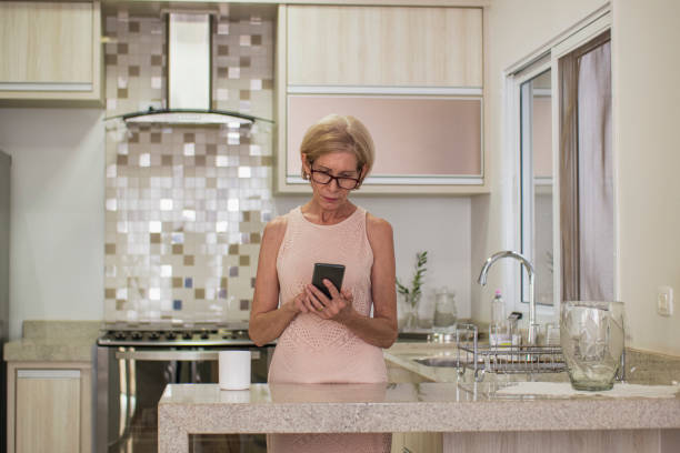istock Mature caucasian woman working at home. 1300601079