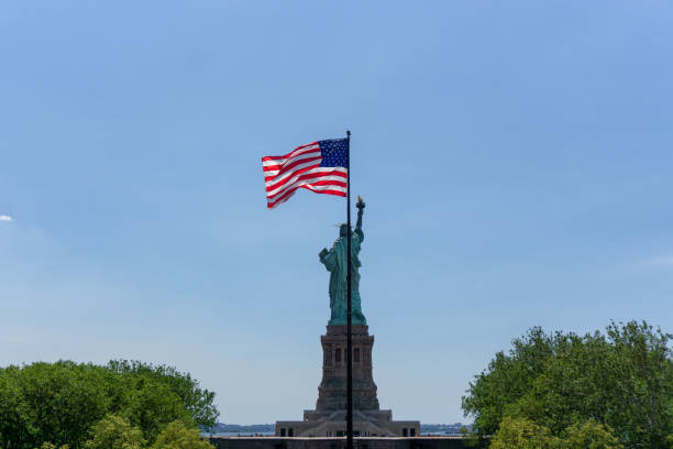 istock American Flag and Statue of Liberty 1300602914