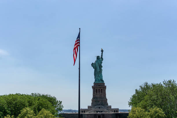 istock American Flag and Statue of Liberty 1300603027
