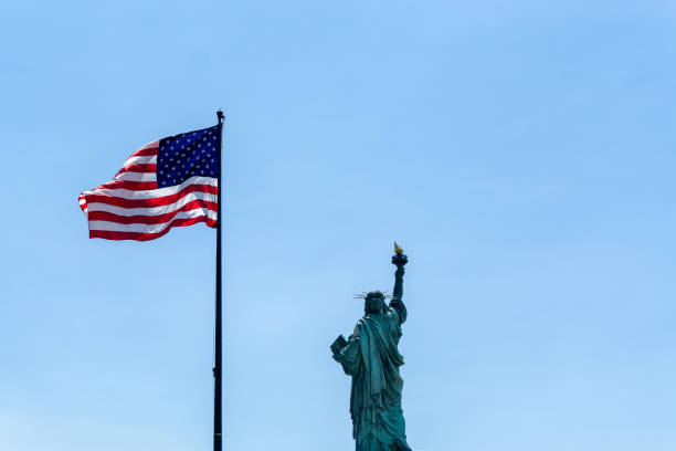 istock American Flag and Statue of Liberty 1300603043