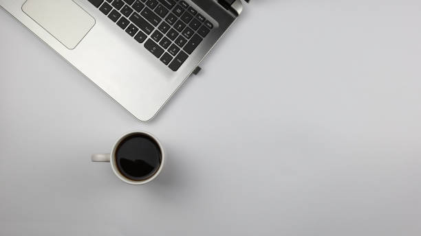istock laptop and a cup of coffee 1300603798