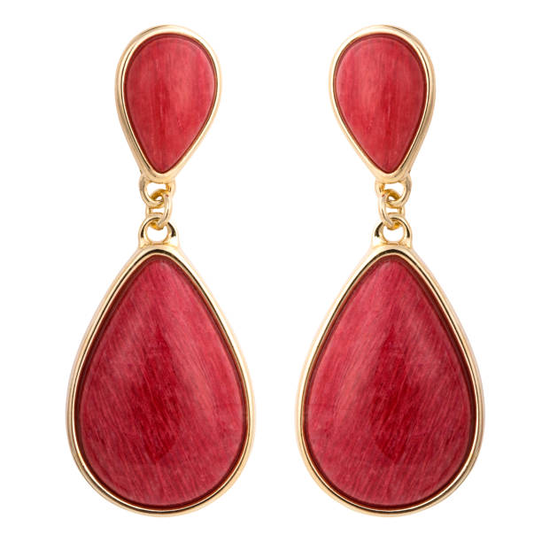 istock Golden earrings with gemstone isolated on white background 1300606354