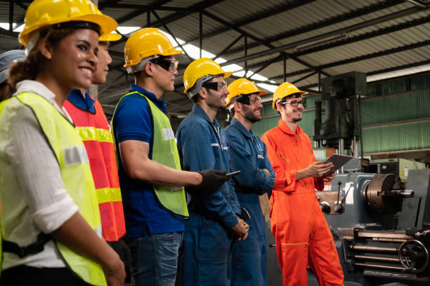 istock Skillful worker attending brief meeting in the factory . 1300608070