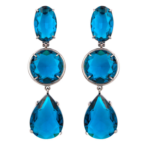 istock Golden earrings with gemstone isolated on white background 1300608098