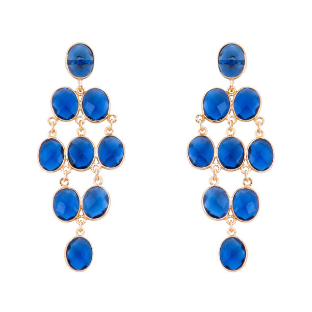 istock Golden earrings with gemstone isolated on white background 1300608371