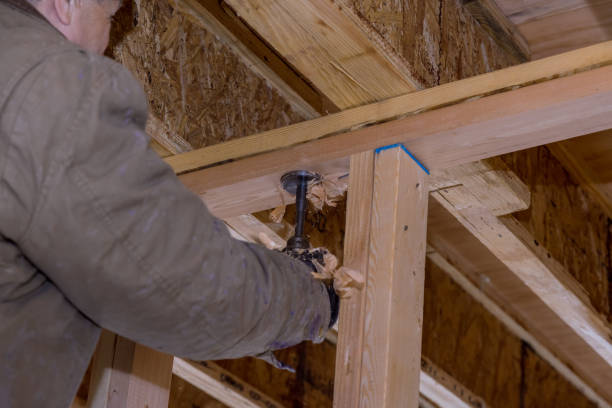 istock Pumping contractor for drilling hole in joist for ABS and PVC drain pipe 1300610165