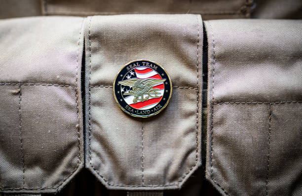istock A US Navy SEALS coin on a magazine pouch background 1300610938
