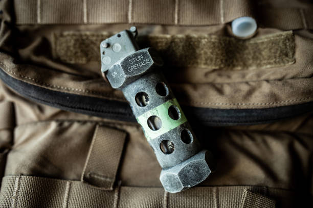 a flash bang grenade on backpack - military airplane flash imagens e fotografias de stock