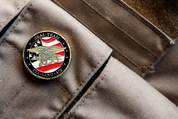 istock A US Navy SEALS coin on a magazine pouch background 1300610946
