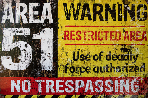 An old rusted looking Area 51 warning sign.