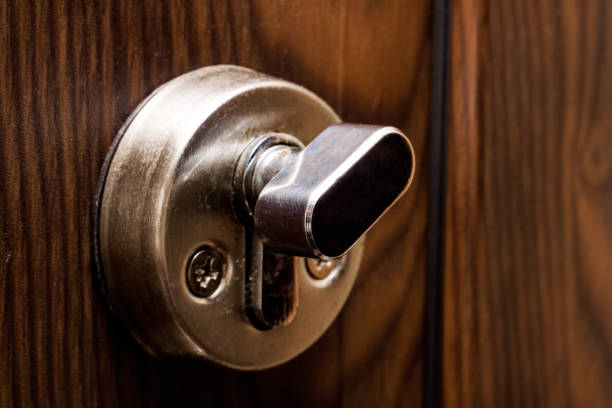 istock Latch on a wooden door close up 1300616214