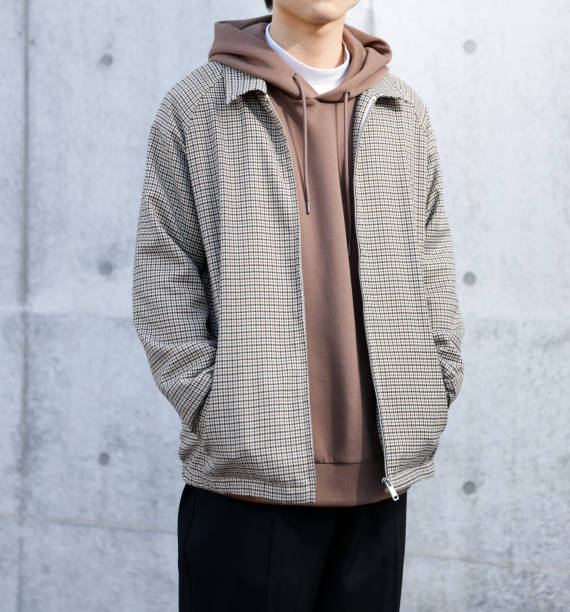 istock Young man standing in front of a concrete wall 1300618494