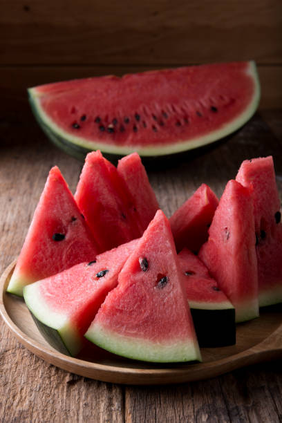 istock Watermelon on wooden table background 1300618662