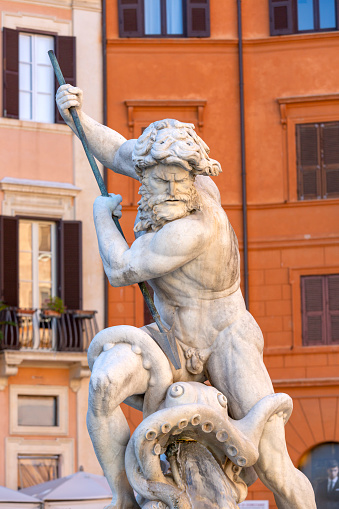 Rome, Italy - October 9, 2020: 16th century Fountain of Neptune (Fontana del Nettuno) located in Piazza Navona. Sculpture of Neptune fighting with an octopus