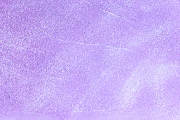 istock Abstract light purple blank bright colorful decorative plaster background with rough textured shabby surface 1300621388