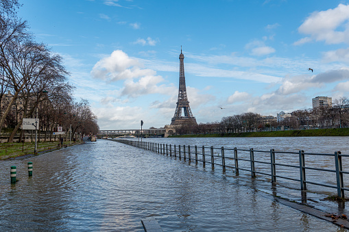 Flood of the Seine river with Eiffel tower and Pont de Bir-Hakeim in the background - Paris, France