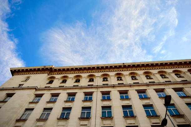 istock Blue sky and white clouds with corner of the nice architectural building 1300631145