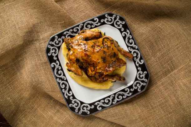 istock Little Chicken dish with polenta on wood background 1300631269