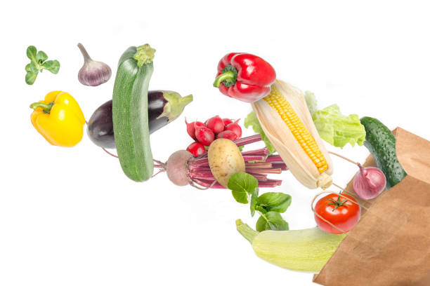 istock Paper bag full of different food on white background 1300634309