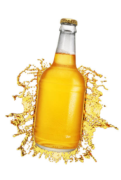 istock Beer bottle with droplets and splash isolated on white. 1300634333