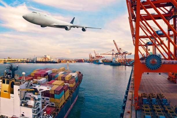 istock Cargo airplane flying over the commercial port. 1300635232