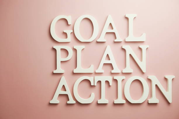 istock Goal Plan Action alphabet letter flat lay on pink background 1300635289