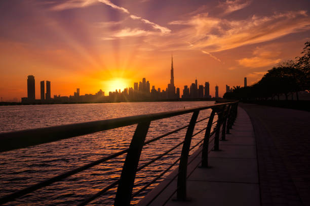 istock Dubai skyline during sunset with colorful sky. Beautiful Dubai city skyline panoramic view from Al Jaddaf in Dubai, United Arab Emirates. 1300637807