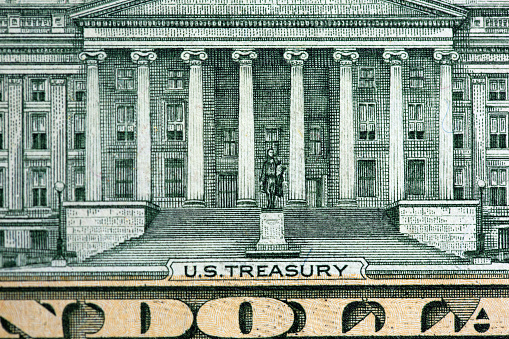 High-res macro image of US Treasury on a $10 bill.