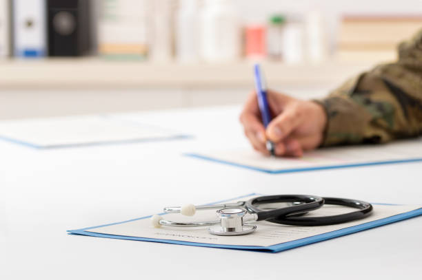 istock army doctor filling out paperwork 1300643680