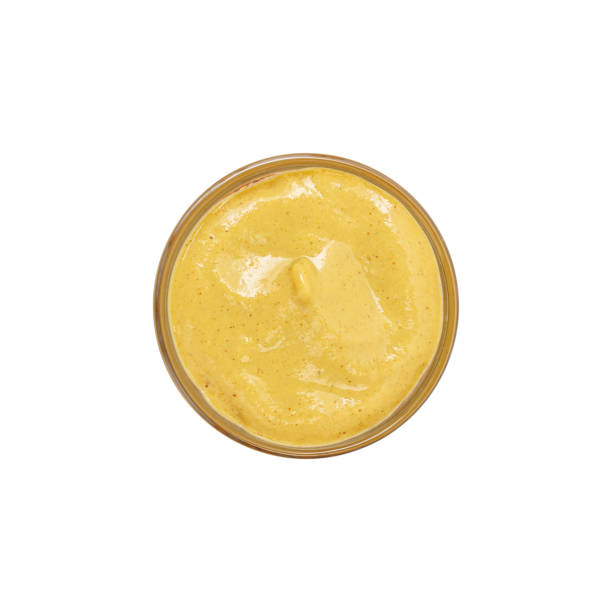 istock Mustard in a bowl isolated on white background 1300644041